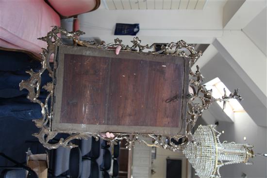 A George III Chippendale style carved and giltwood wall mirror, in the manner of Mathias Lock, W.2ft 3in. H.4ft 5in.